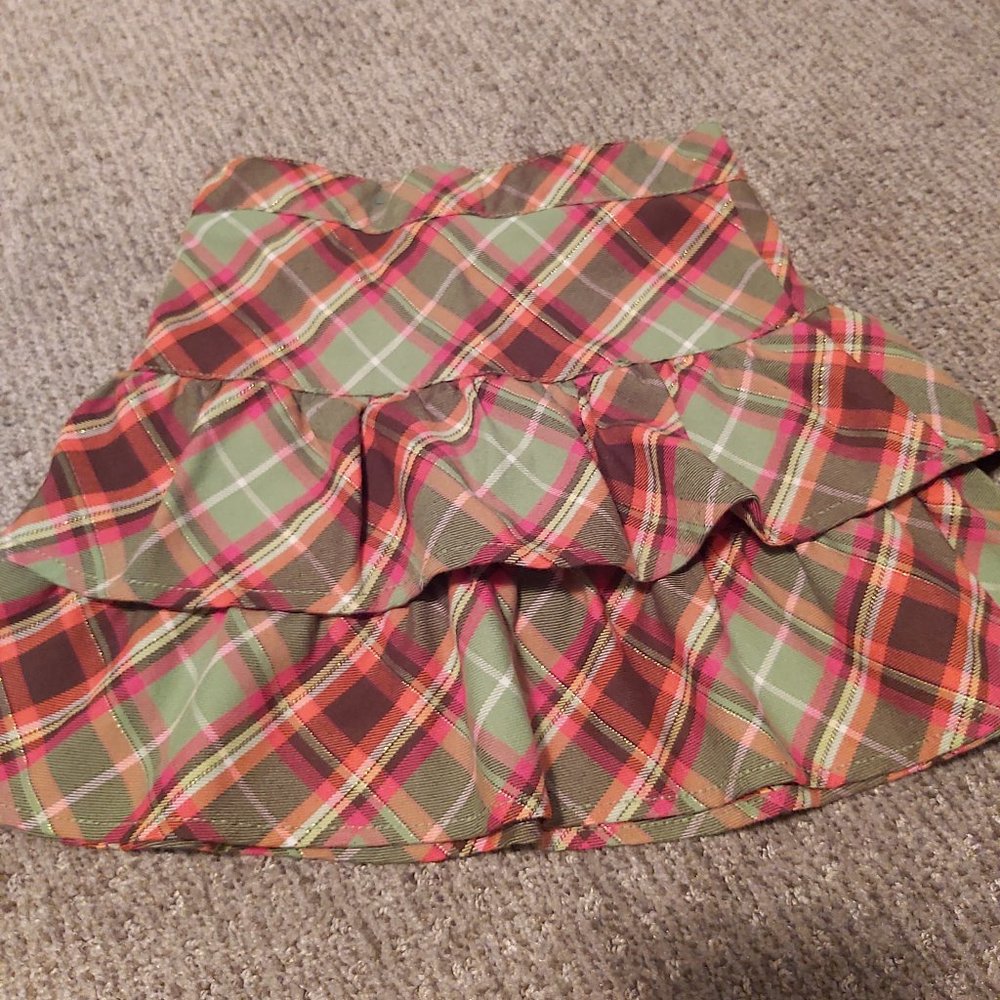 Skirt with under shorts. Green and red plaid style.